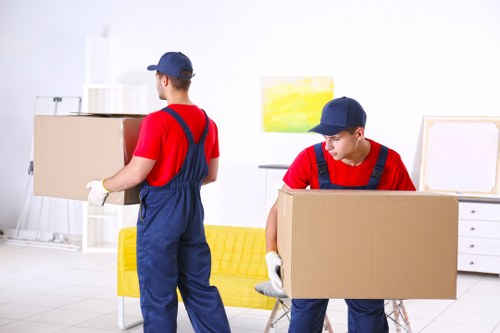 Team reviewing ethical labour compliance documents for Man And Van Kingston Vale