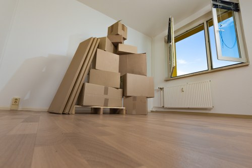 House removalists assisting a Kingston Vale home move with furniture and boxes