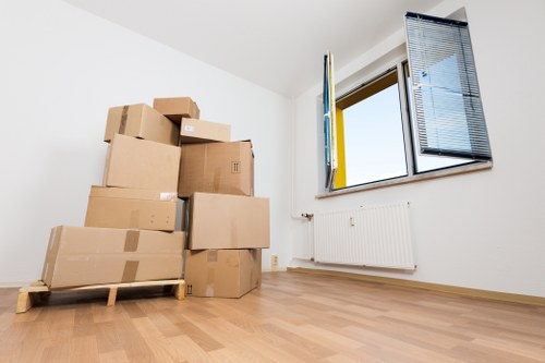 Packed moving boxes and furniture ready for transport