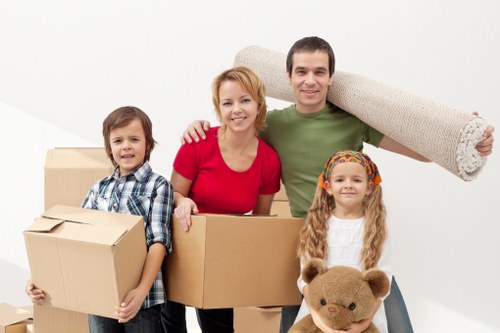 Professional moving team handling furniture in Kingston Vale